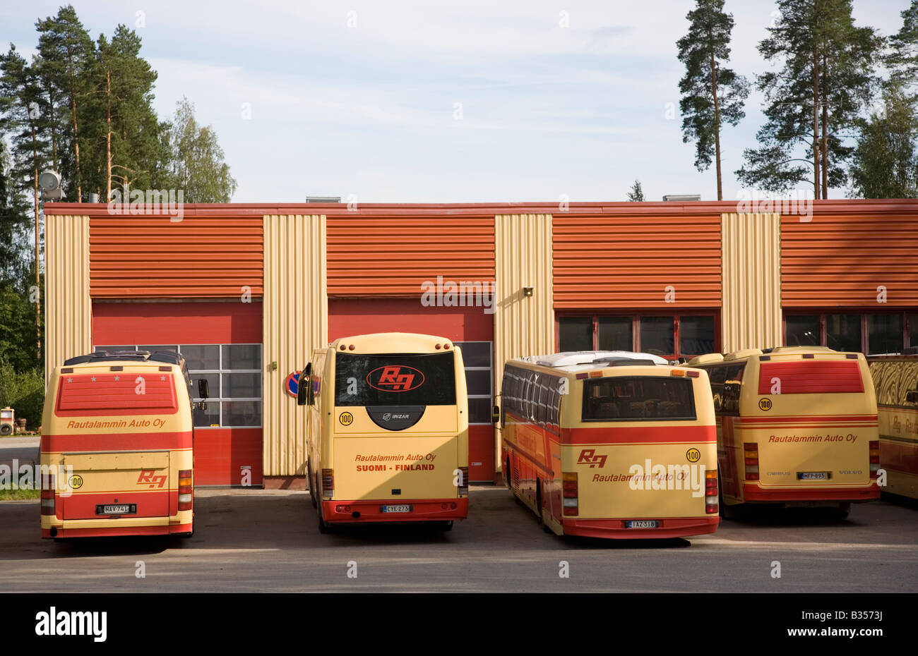 Lineup of parked buses at bus depot , Finland Stock Photo