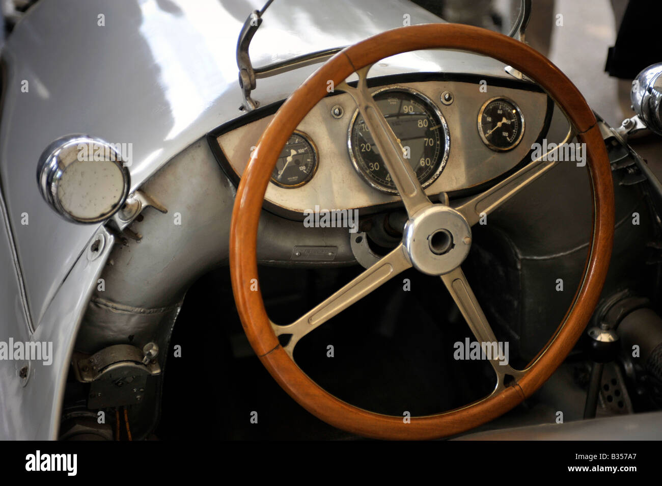 Panhard et Lavassor1908 Grand Prix car cockpit interior withwood rim steering wheel Stock Photo