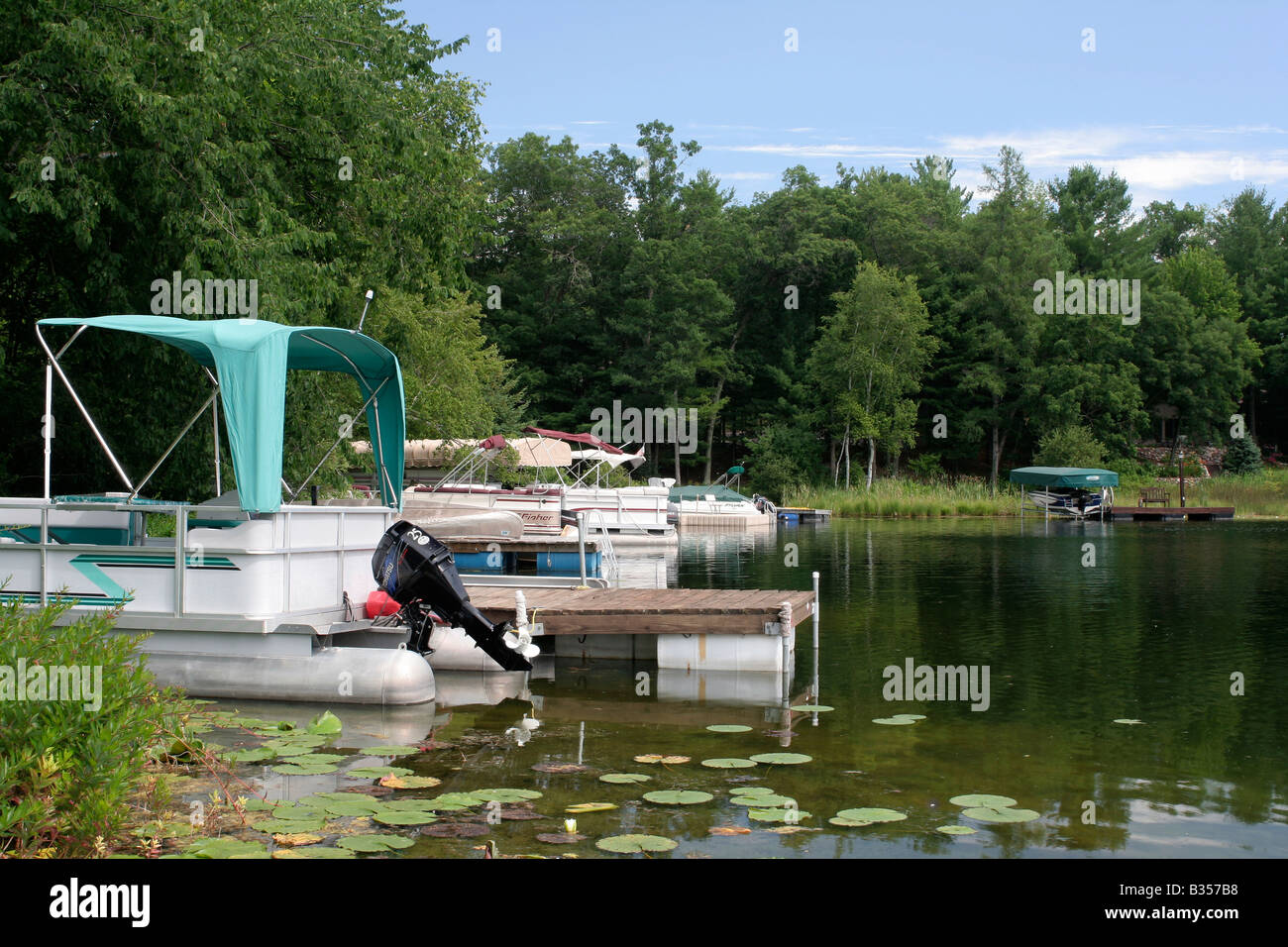 Homeowner docks on Otter Lake near Waupaca Wisconsin Stock Photo - Alamy