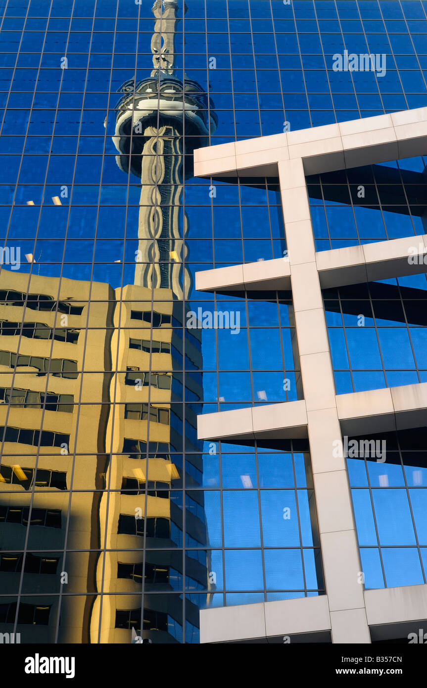 Reflection of the CN tower and highrise building in the glass windows of the CBC building in Toronto Canada Stock Photo
