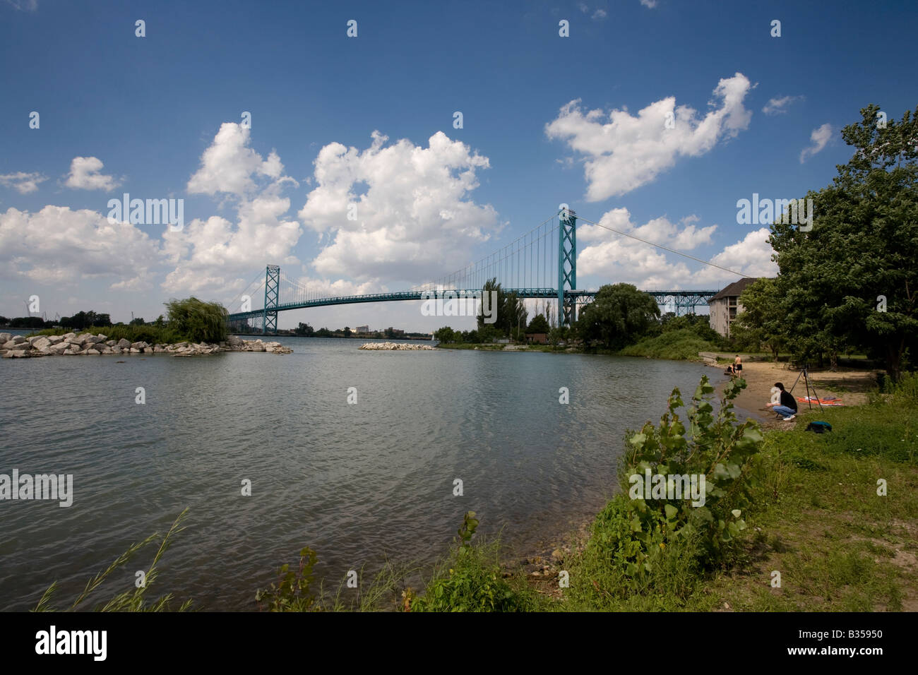 Ambassador Bridge over Detroit River from Windsor Ontario Canada perspective on a beautiful, sunny afternoon Stock Photo