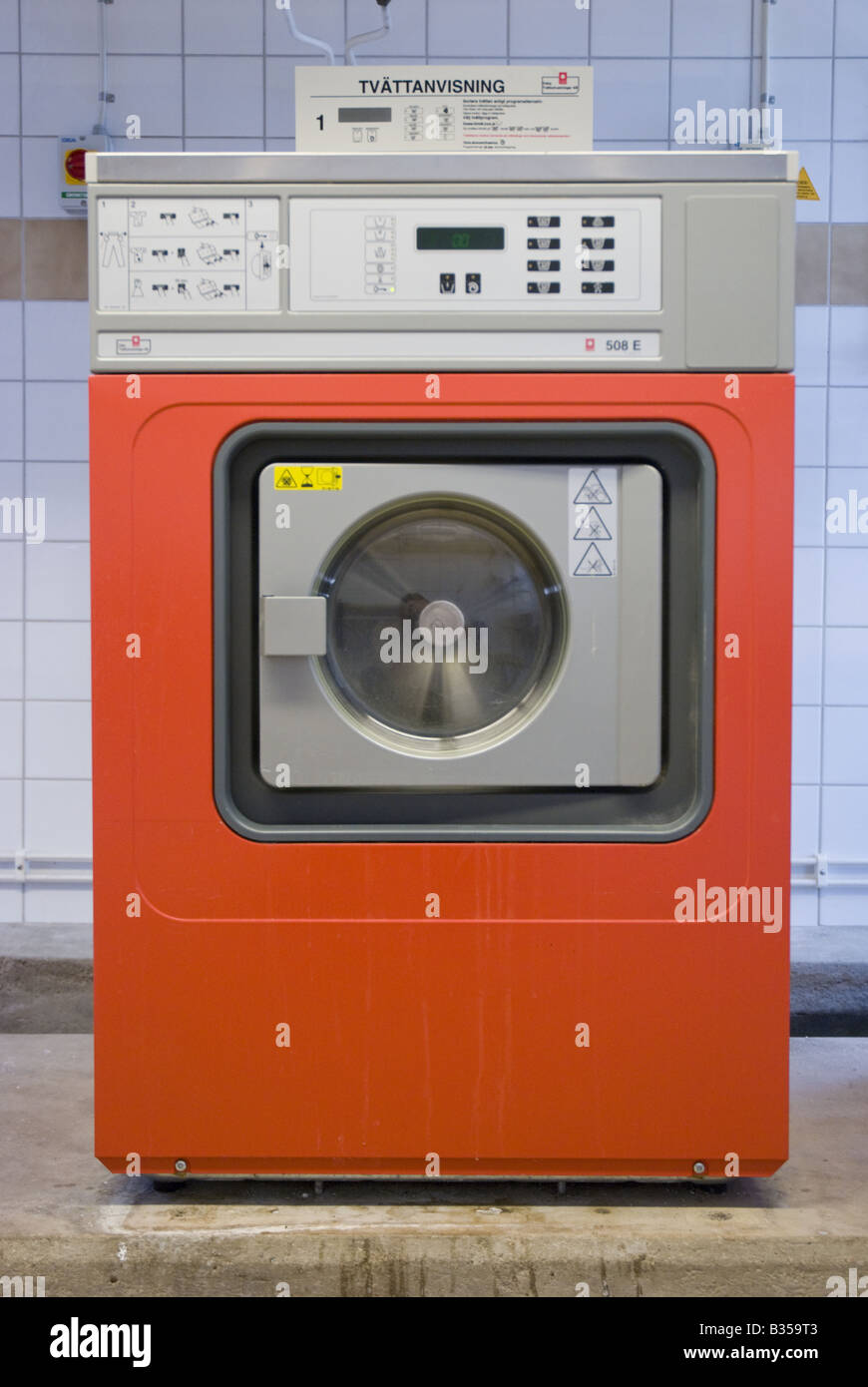 An orange washing machine in a communal laundry in Gothenburg, Sweden Stock  Photo - Alamy