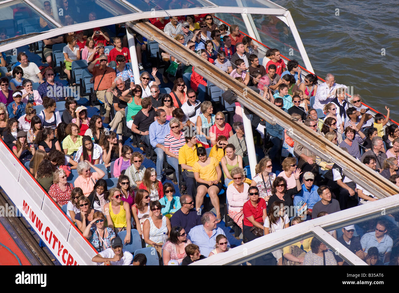 Tourists enjoy river cruise on Thames River London United Kingdom Stock Photo