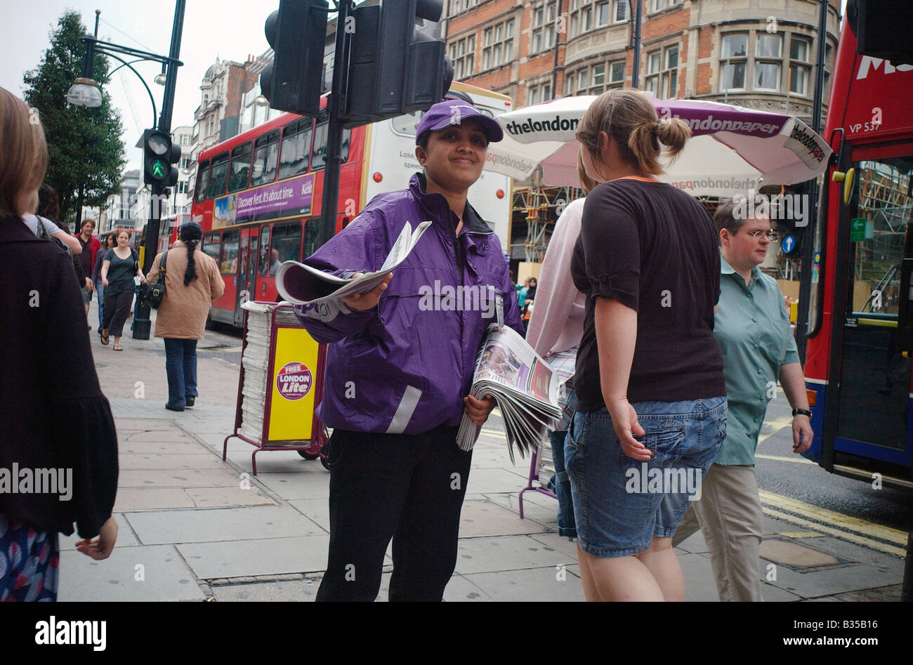 Free newspaper distributor Stock Photo Alamy