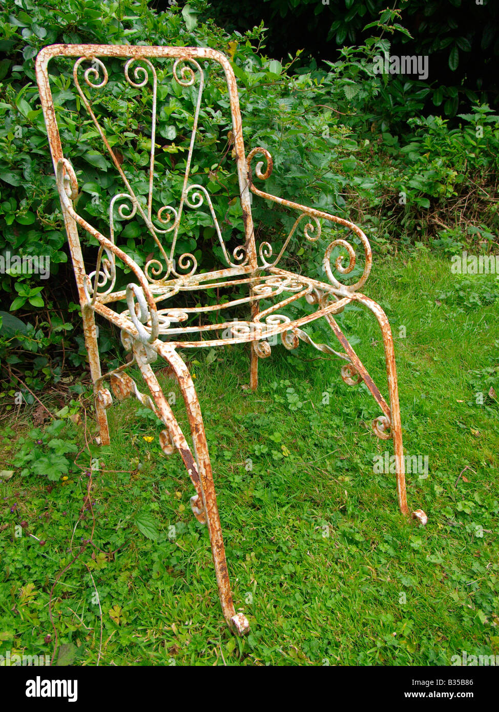 old wrought iron garden chair Stock Photo Alamy