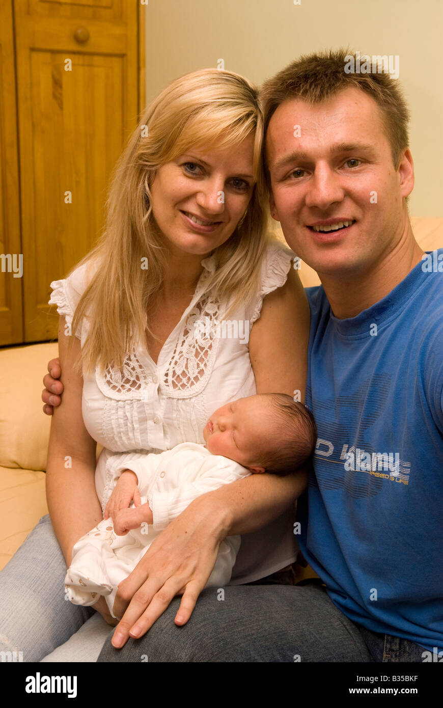Polish woman [38 years] with her Polish partner [34 years] and 4 day old baby girl, Feltham, Middlesex UK Stock Photo