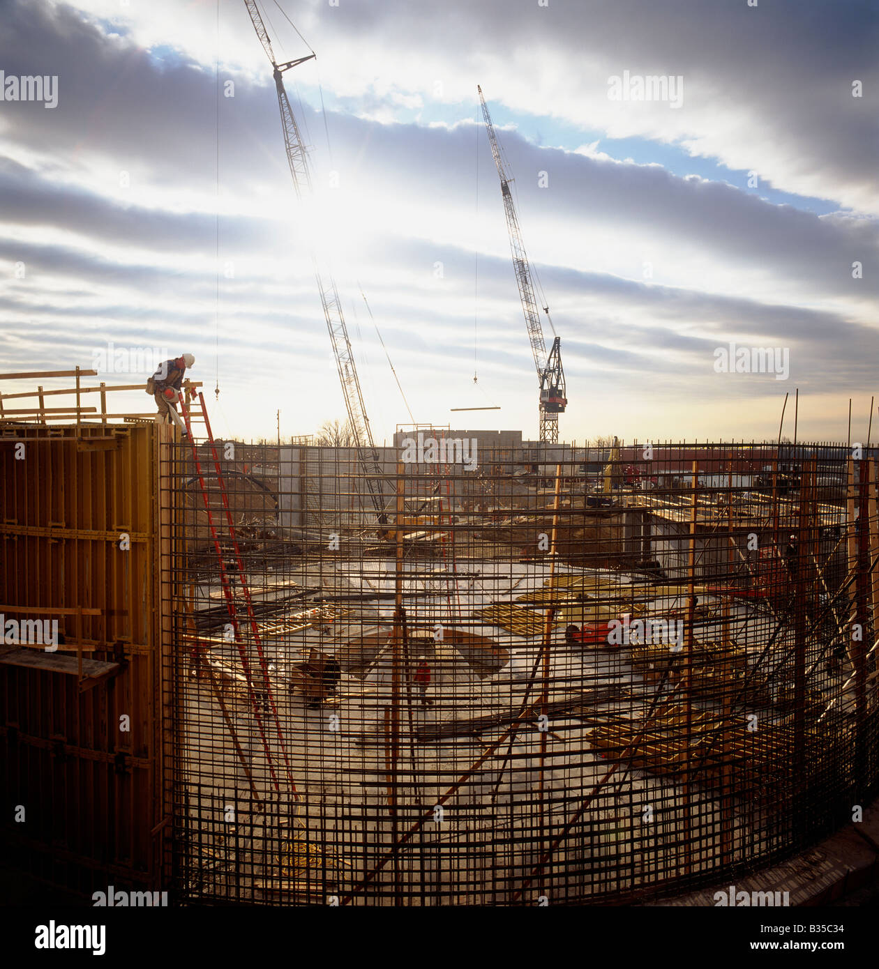 Reenforcing bar and workers build a water treatment plant in St