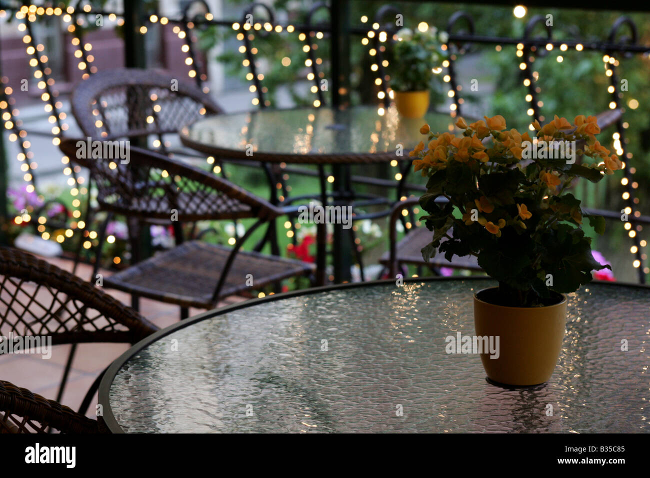 Close up of romantic, lighted patio seating area. Stock Photo