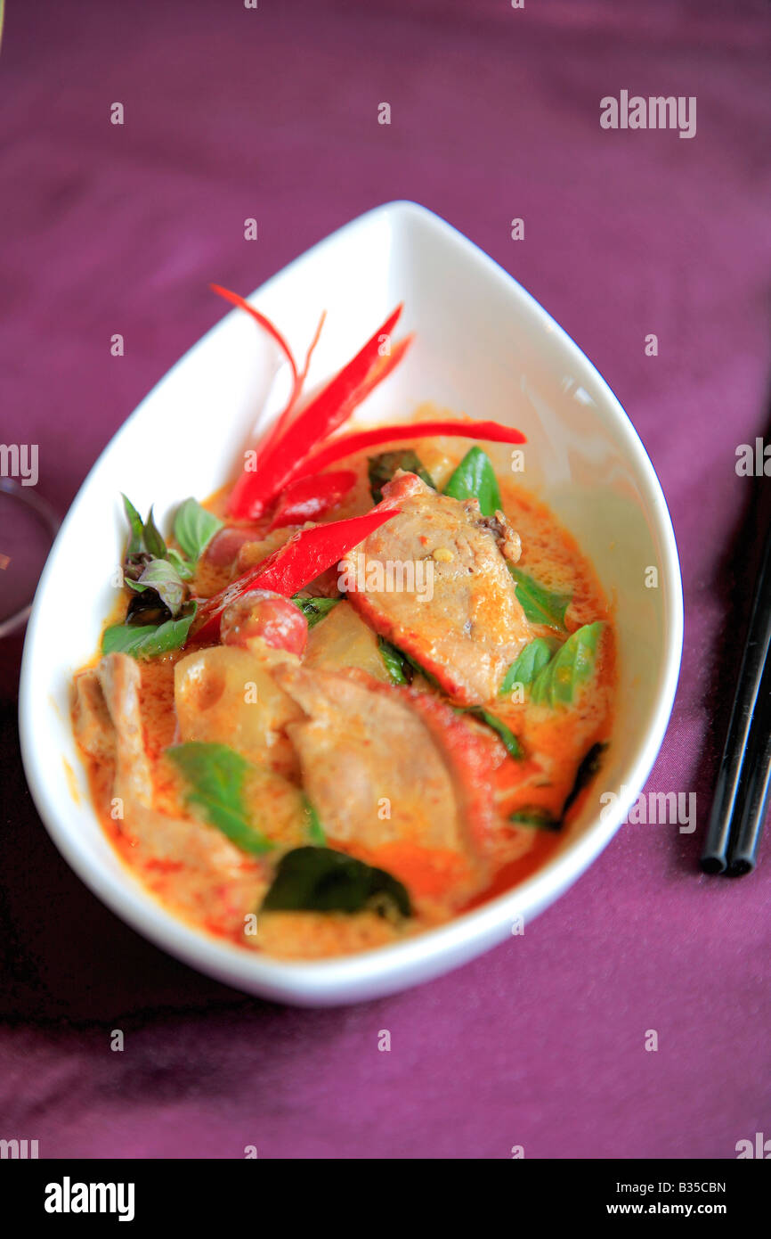 Oriental Cuisine of Thai Food, Szechuan Duck, Stir Fried fresh vegetables meal with chopsticks in a restaurant setting Stock Photo