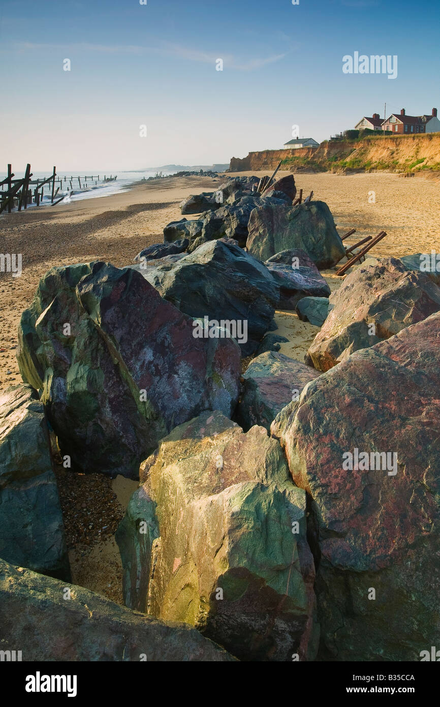 Line of rocks on the beach of Happisburgh, Norfolk, England Stock Photo