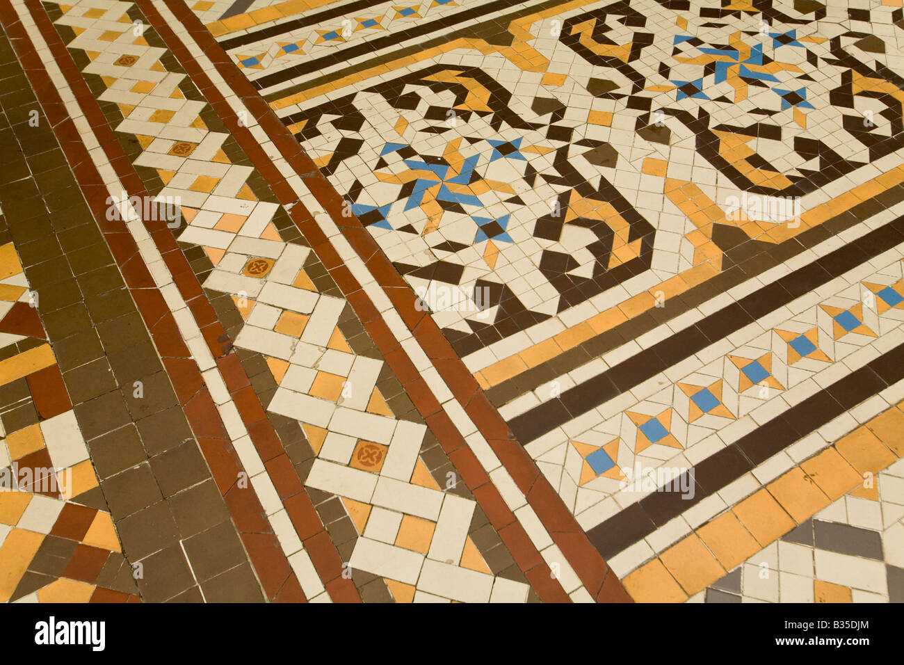 SPAIN Barcelona Geometric mosaic floor tile design patio of Casa Batllo designed Antoni Gaudi architect Modernisme architecture Stock Photo
