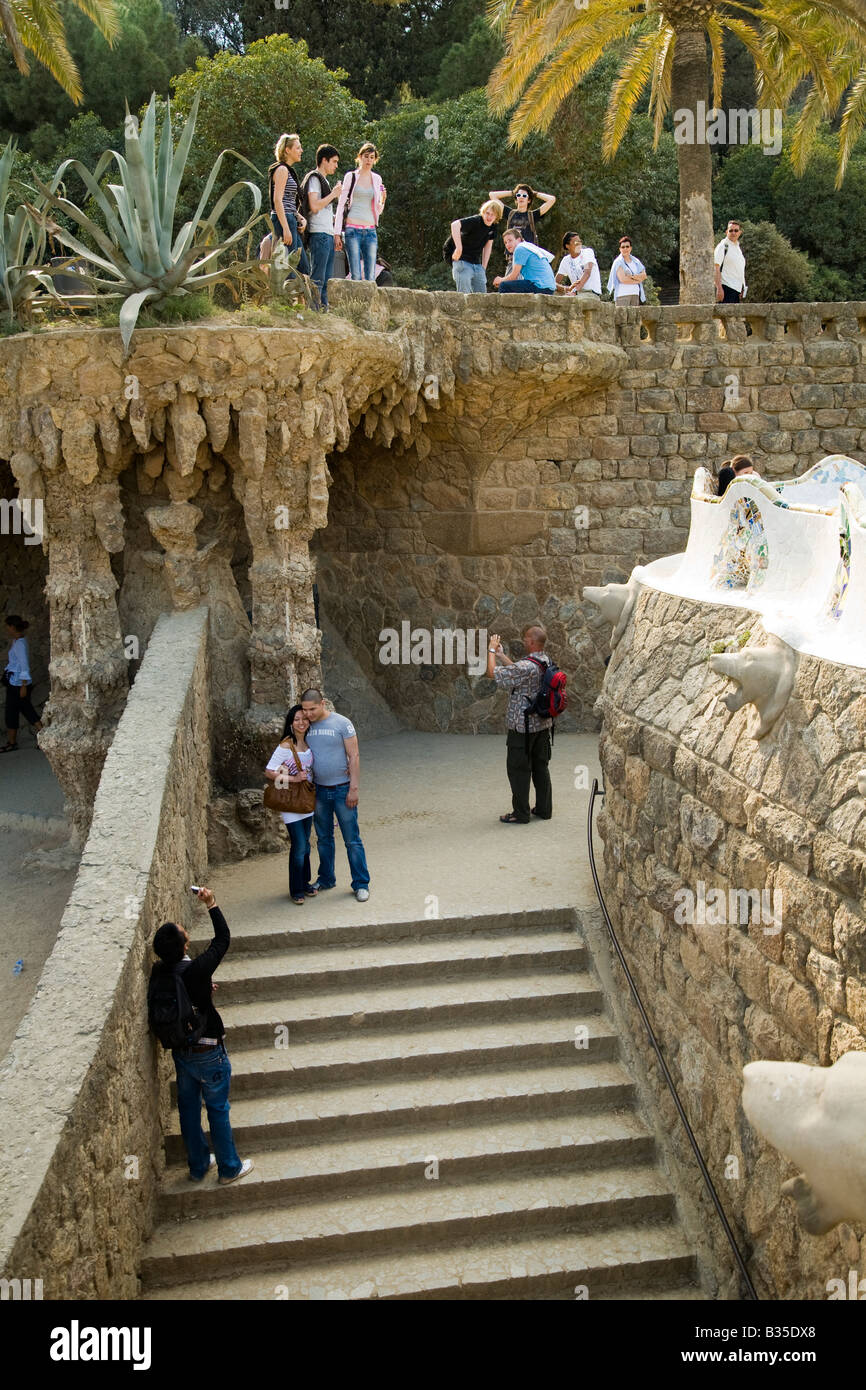 SPAIN Barcelona People on stairs and colonnaded footpath in Parc Guell designed Antoni Gaudi architect Modernisme architecture Stock Photo