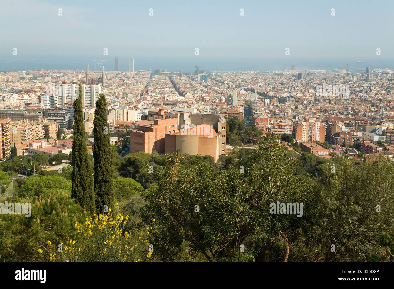 SPAIN Barcelona Overview of city from Parc Guell designed Antoni Gaudi Mediterranean Sea and urban sprawl Stock Photo
