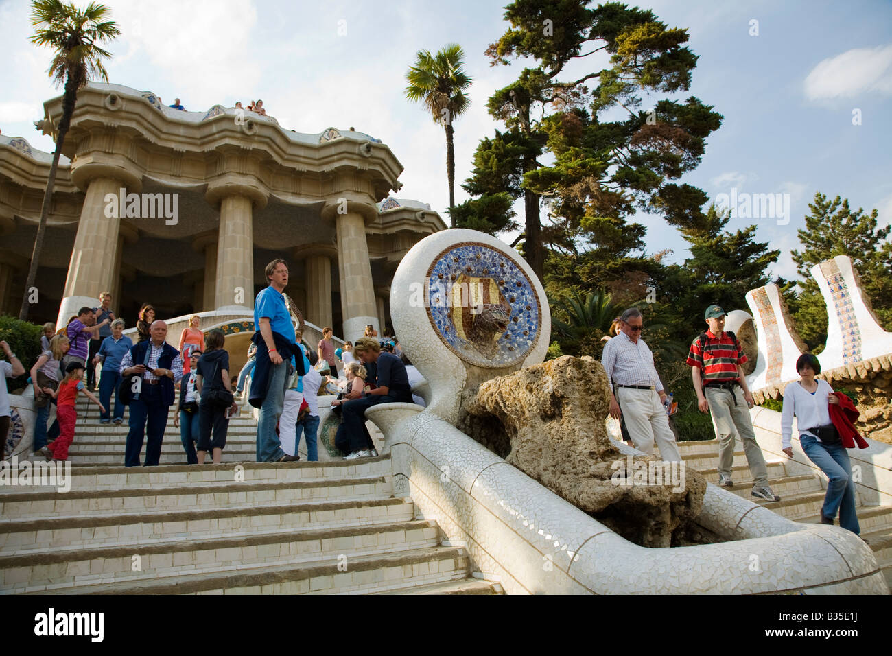 SPAIN Barcelona Dry fountain entrance to Parc Guell designed Antoni Gaudi architect visitors on stairs drought conditions Stock Photo