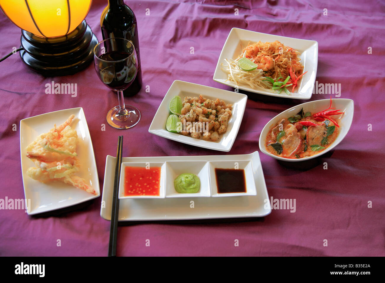 Thai Food Deep Fried Squid Szechuan Duck Dip Sauces Stir Fried fresh vegetables dish in a restaurant setting Stock Photo