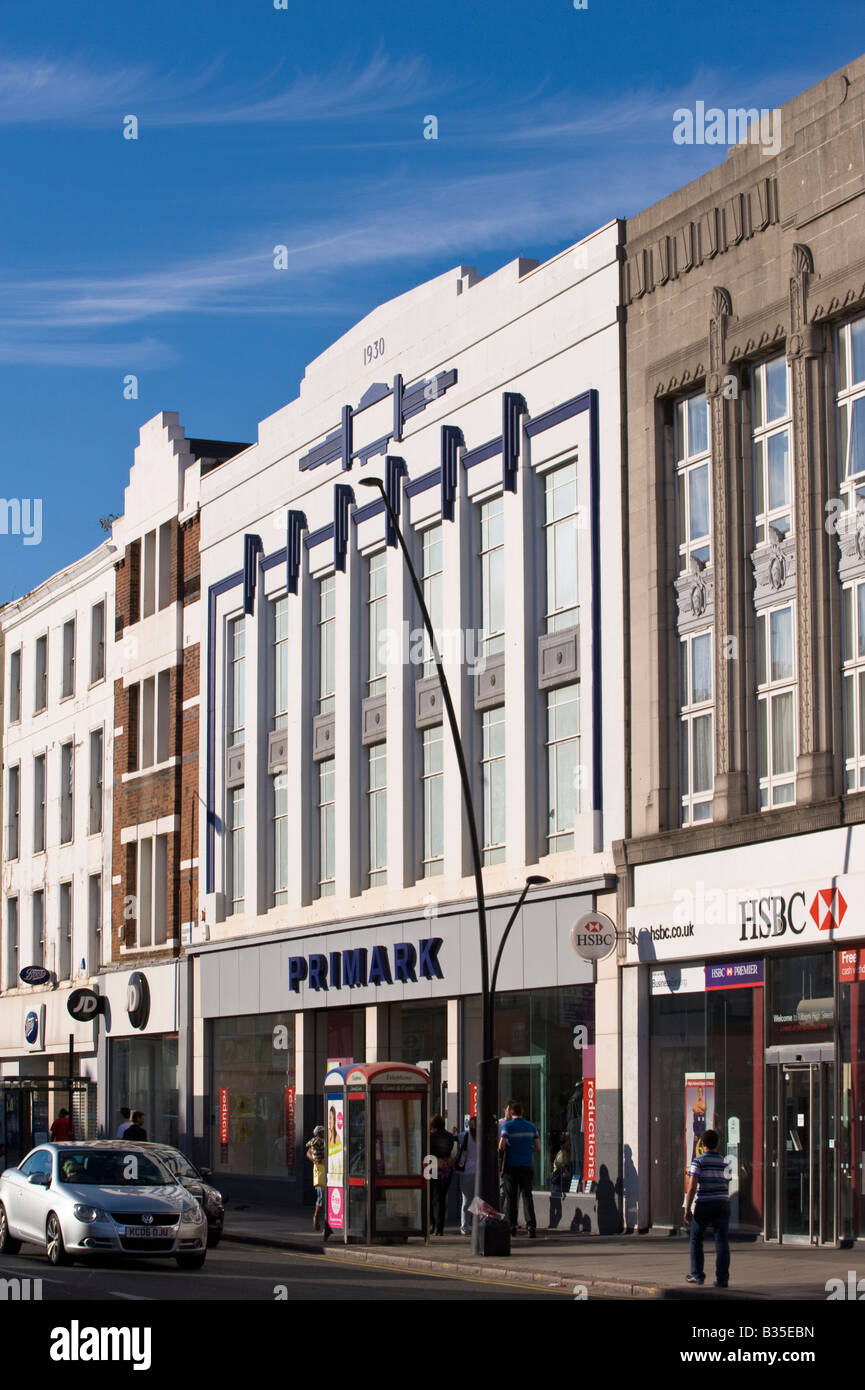 Shops and pedestrians on Kilburn High Road NW6 London United Kingdom