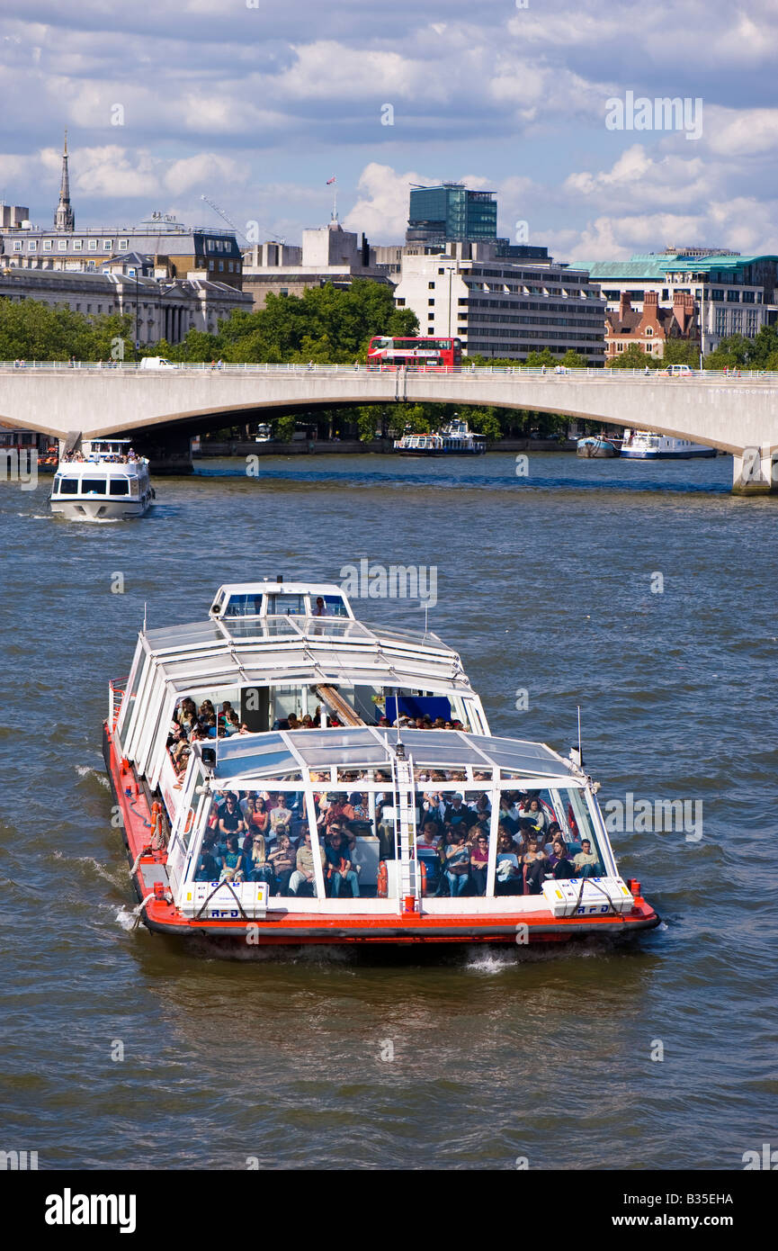Tourists enjoy river cruise on Thames River London United Kingdom Stock Photo