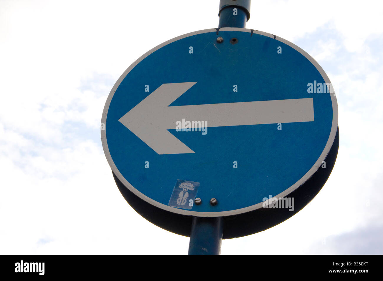 left Arrow signal with London red bus Stock Photo