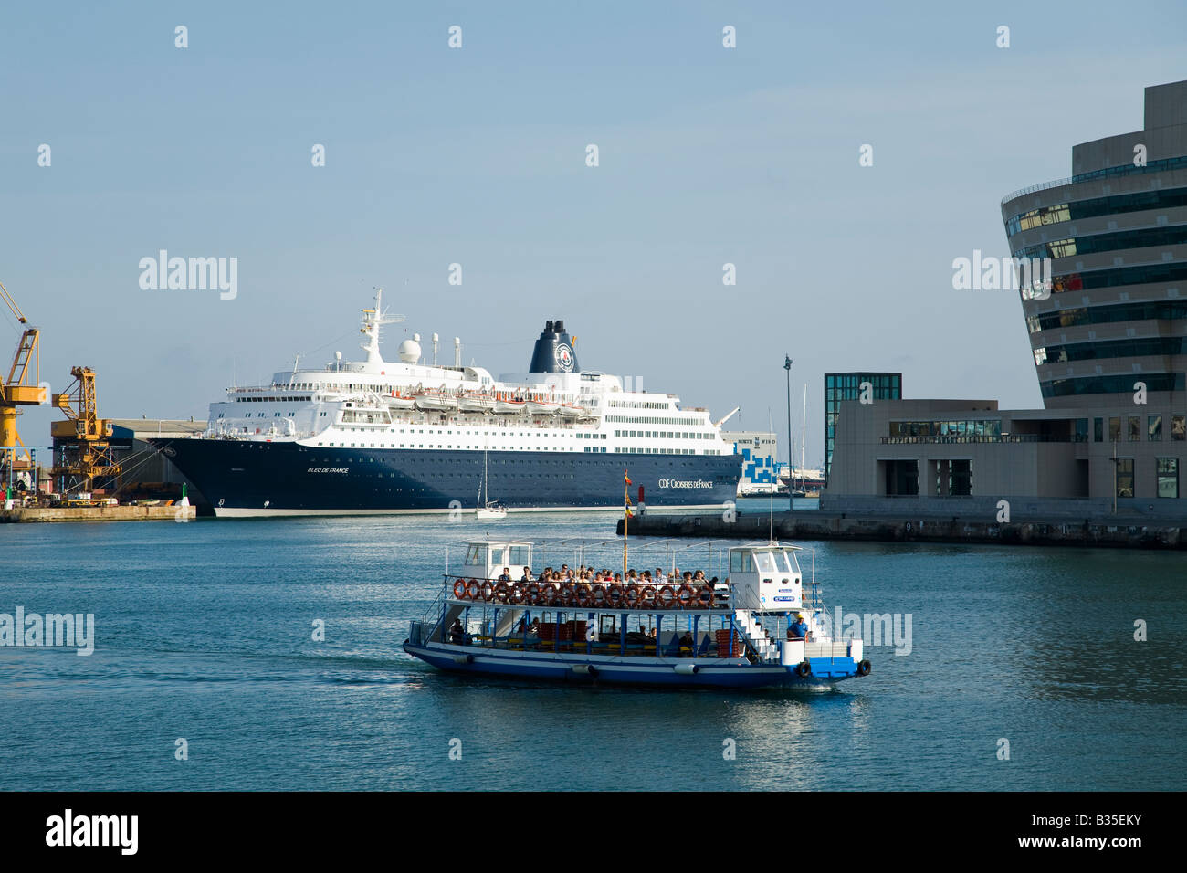 SPAIN Barcelona Tour boat and ferry in harbor of Marina Port Vell Mediterranean Sea Stock Photo