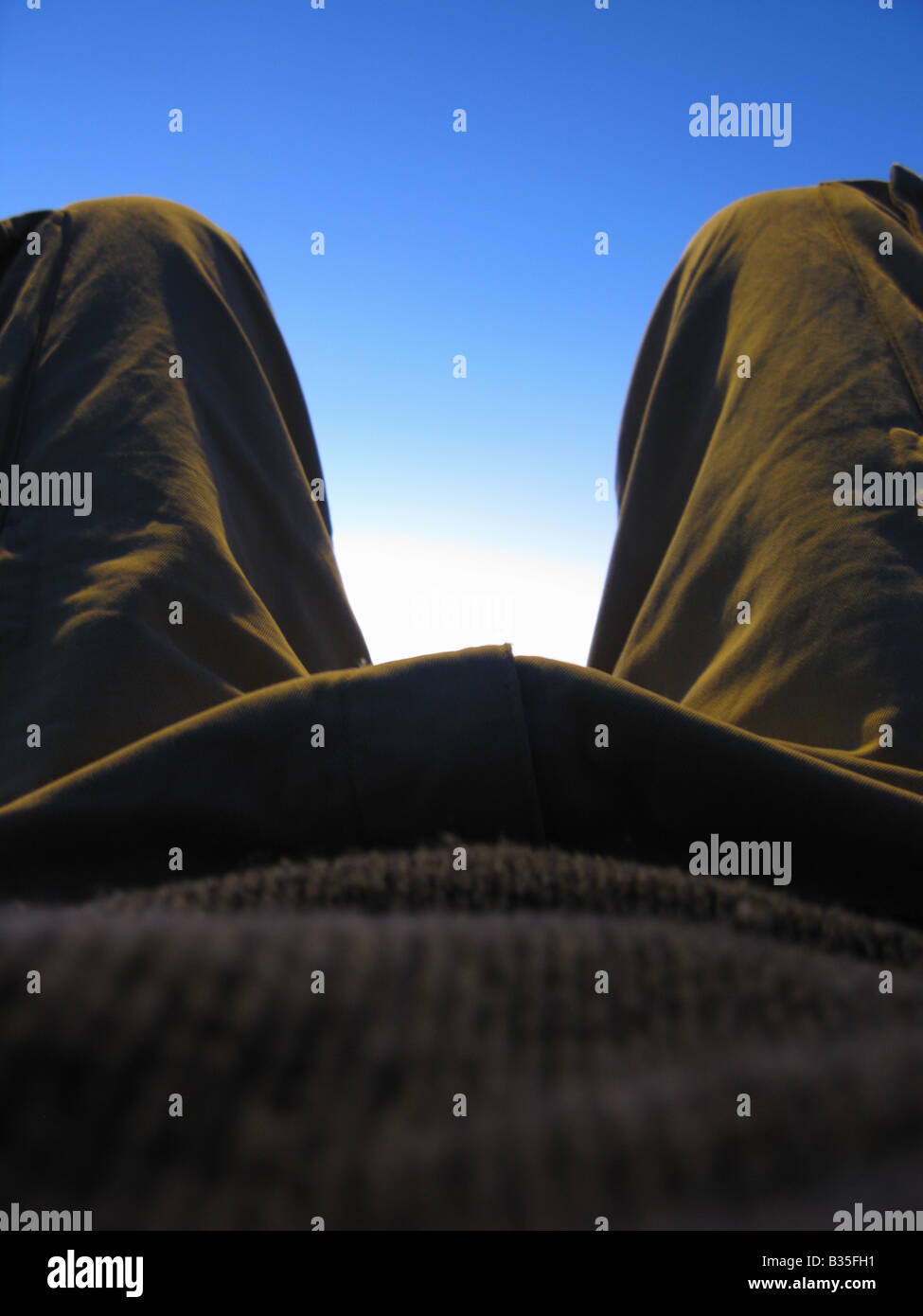 Close up abstract of man lying down with bent knees Stock Photo Alamy