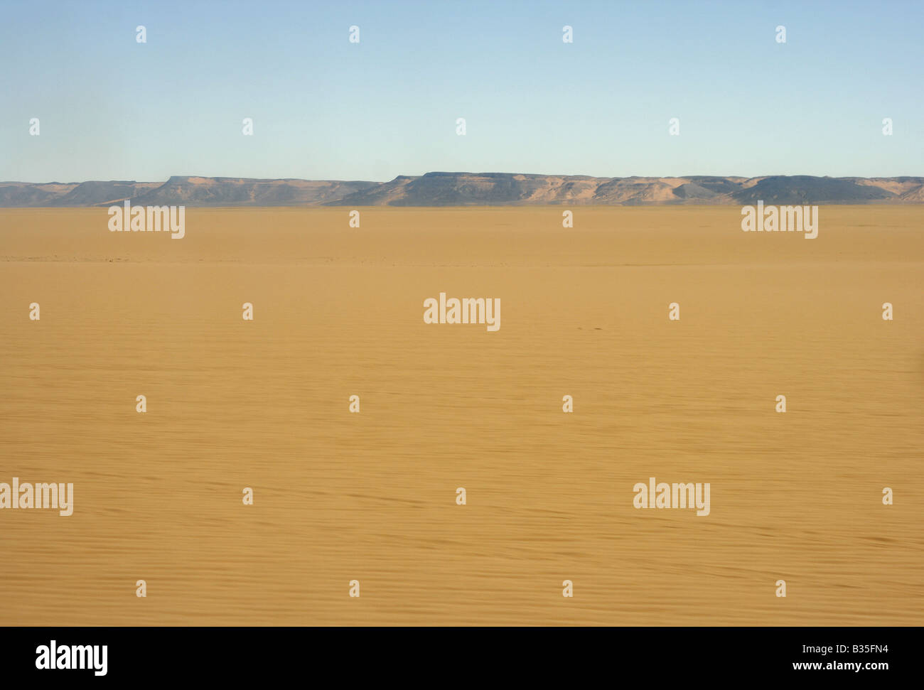 Solitary desert landscape near In Akachaker Tassili Ahaggar Sahara desert Algeria Stock Photo