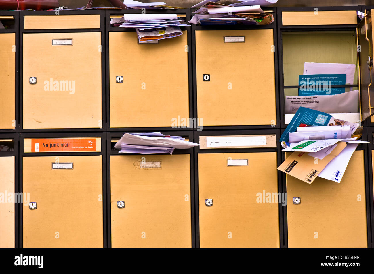 Uncollected mail in letterbox London United Kingdom Stock Photo