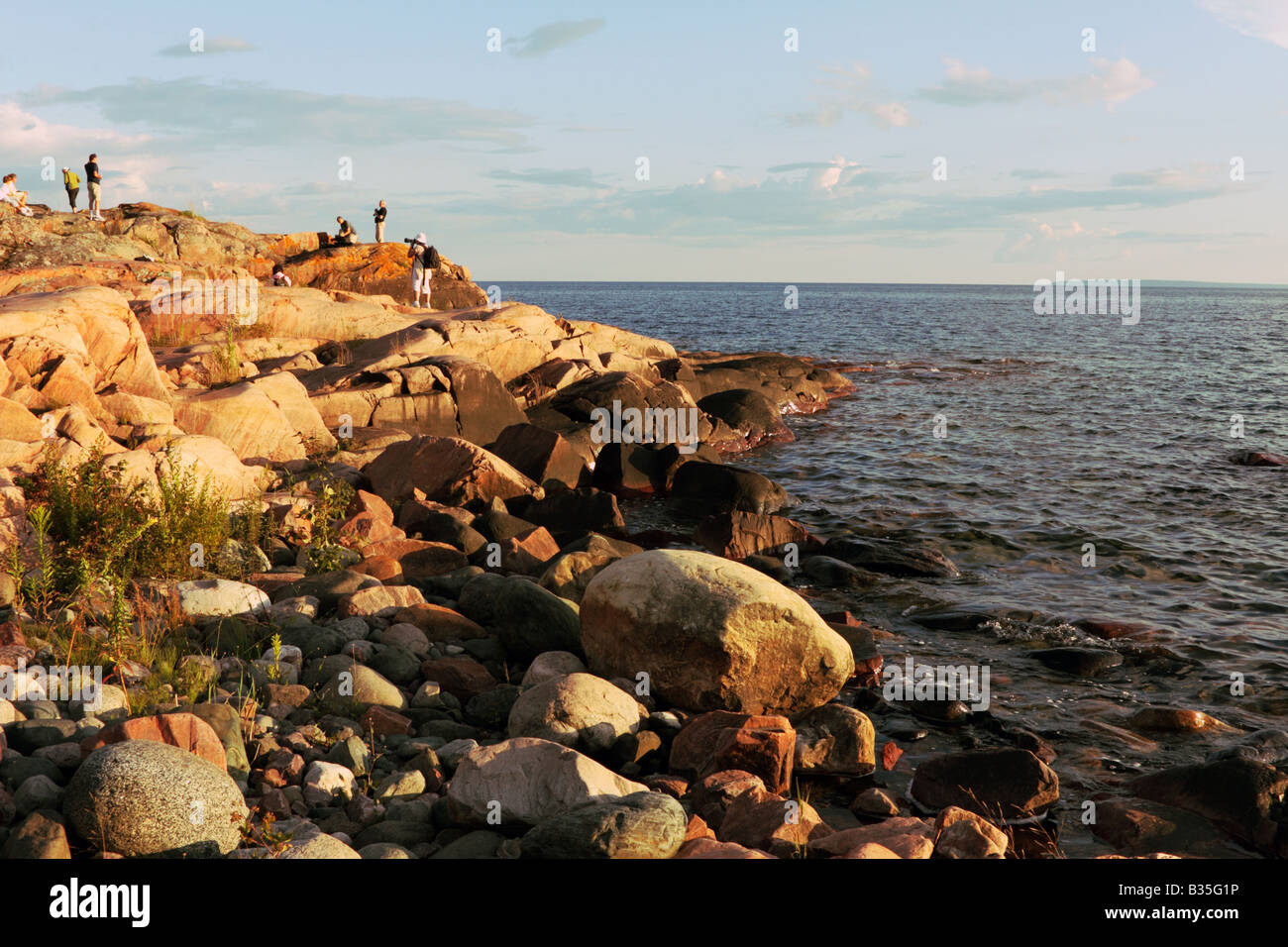 Rocky shore with sunset hi-res stock photography and images - Alamy