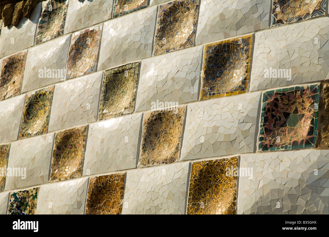 SPAIN Barcelona Detail of mosaic tiles in Parc Guell designed Antoni Gaudi architect Modernisme architecture Stock Photo