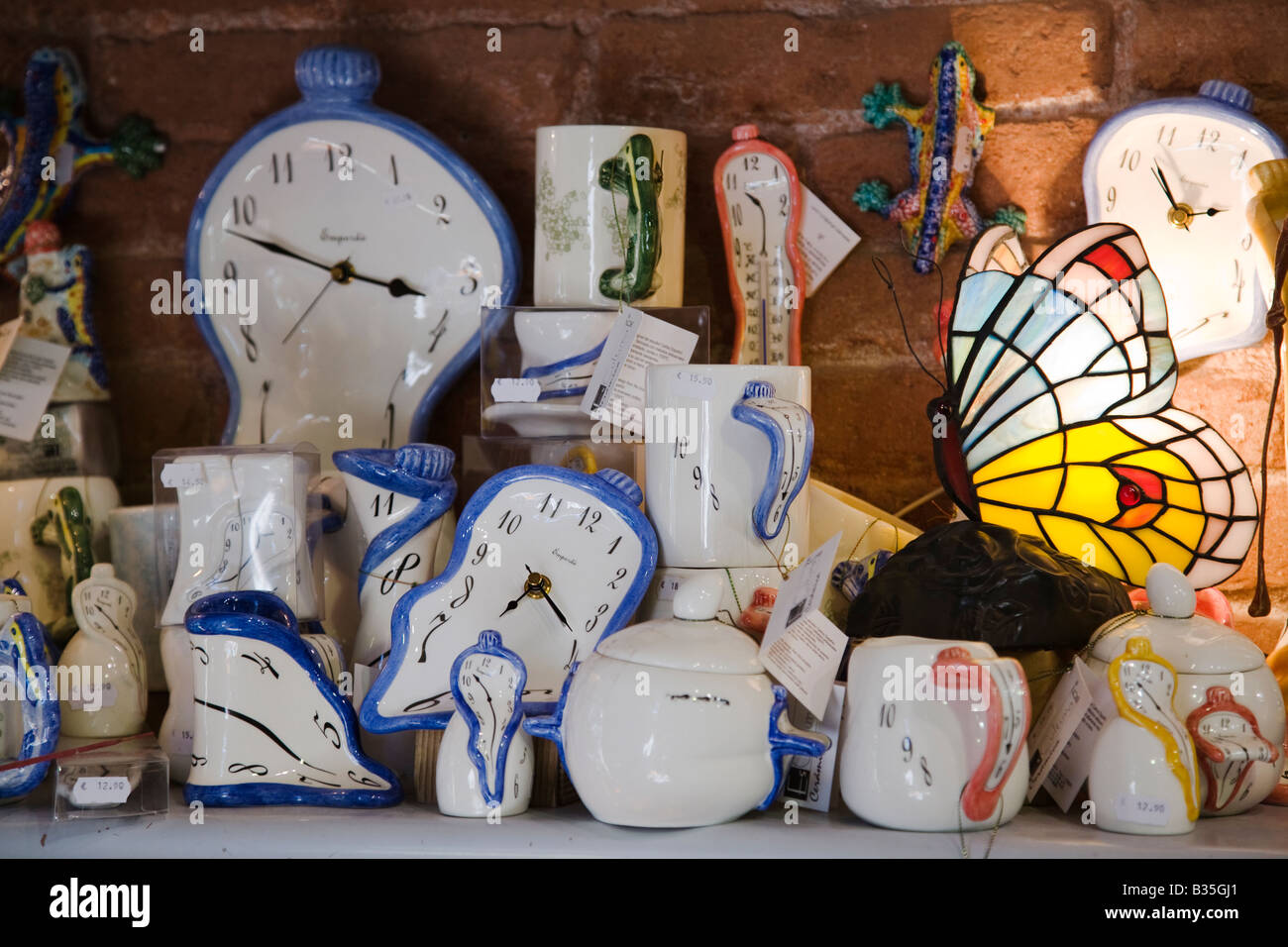 SPAIN Barcelona Gift shop items of Salvador Dali melting clock ceramic and stained glass cups and decorative items Stock Photo