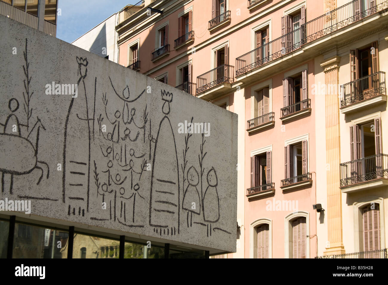 SPAIN Barcelona Architects House with frieze painted in Picasso style contrasted with traditional residential building Stock Photo