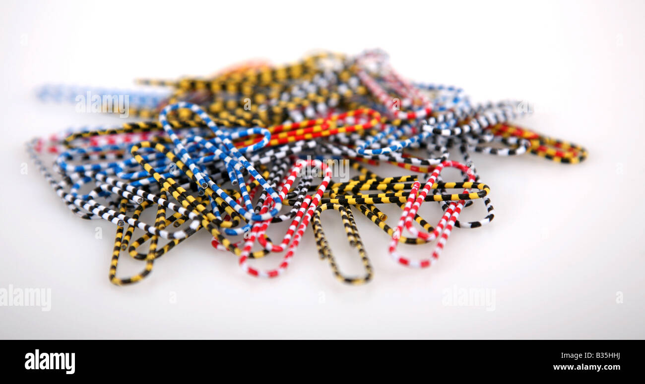 Coloured and patterned paper clips on a white background Stock Photo