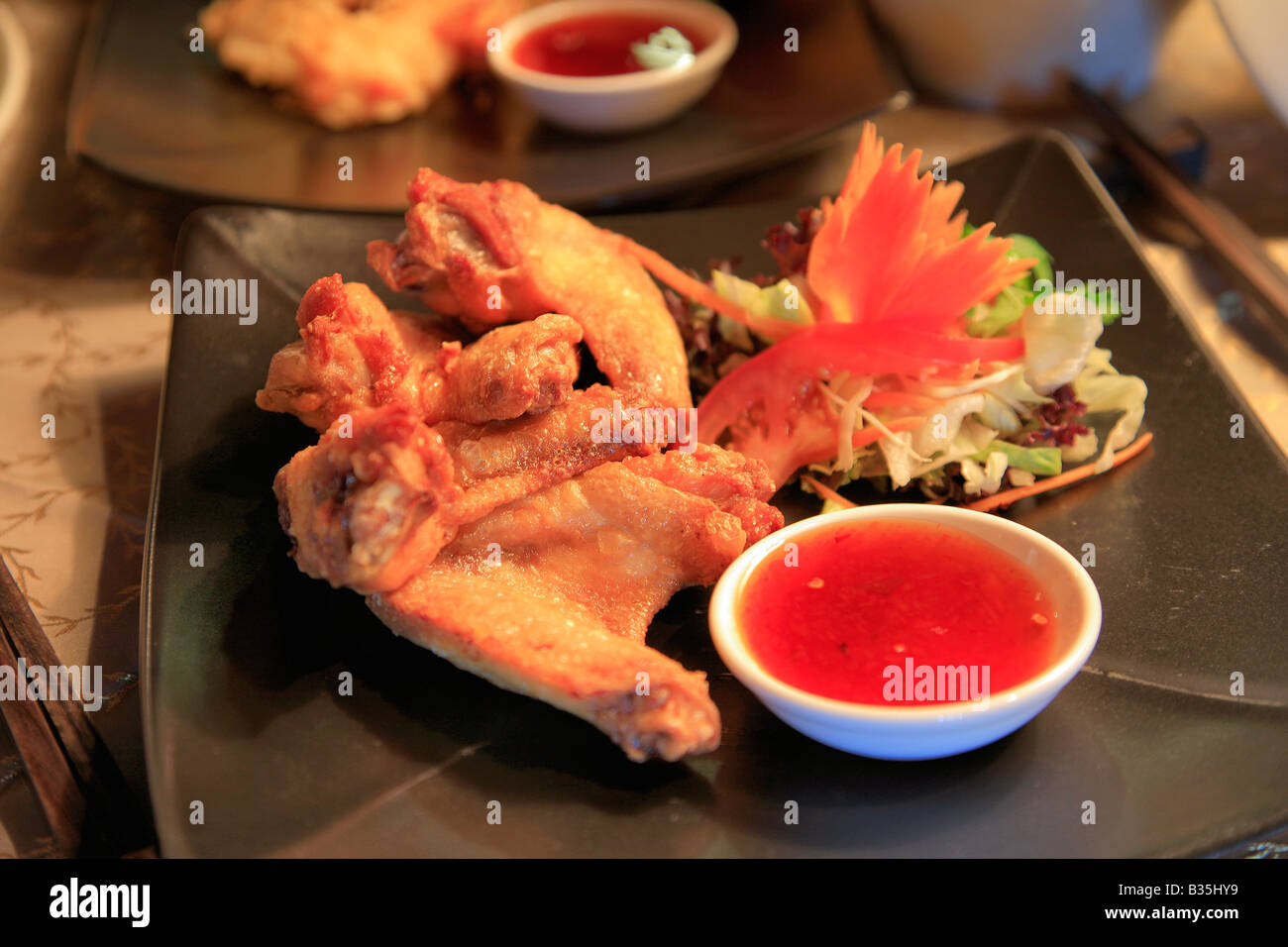 Deep Fried Chicken Wings Thai Food in a restaurant setting Stock Photo