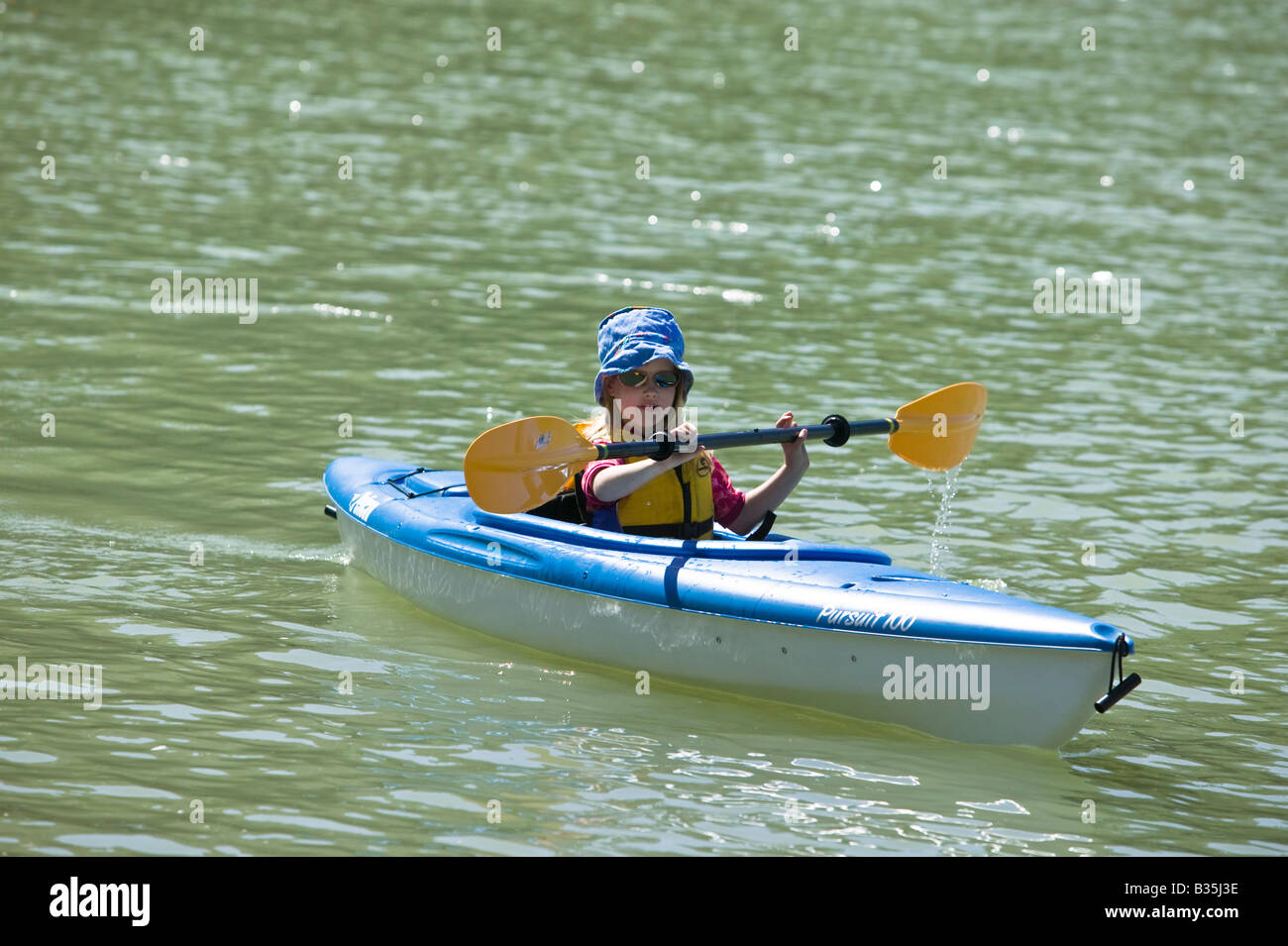 Girl kayaking Eagle Harbour West Vancouver BC Canada Stock Photo