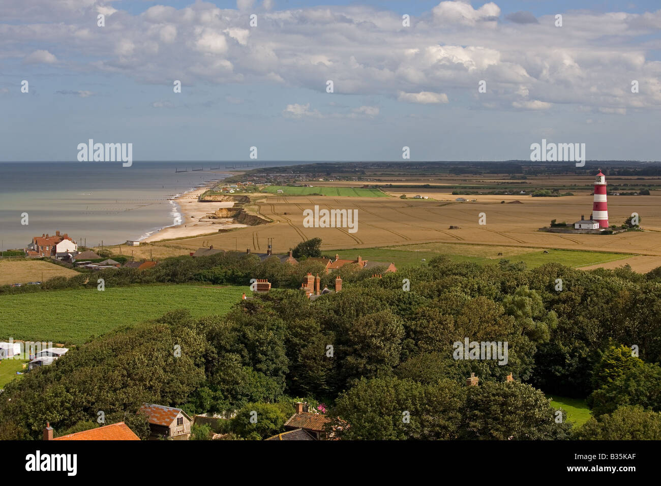 Farmland and Light House Happisburgh Norfolk UK Stock Photo