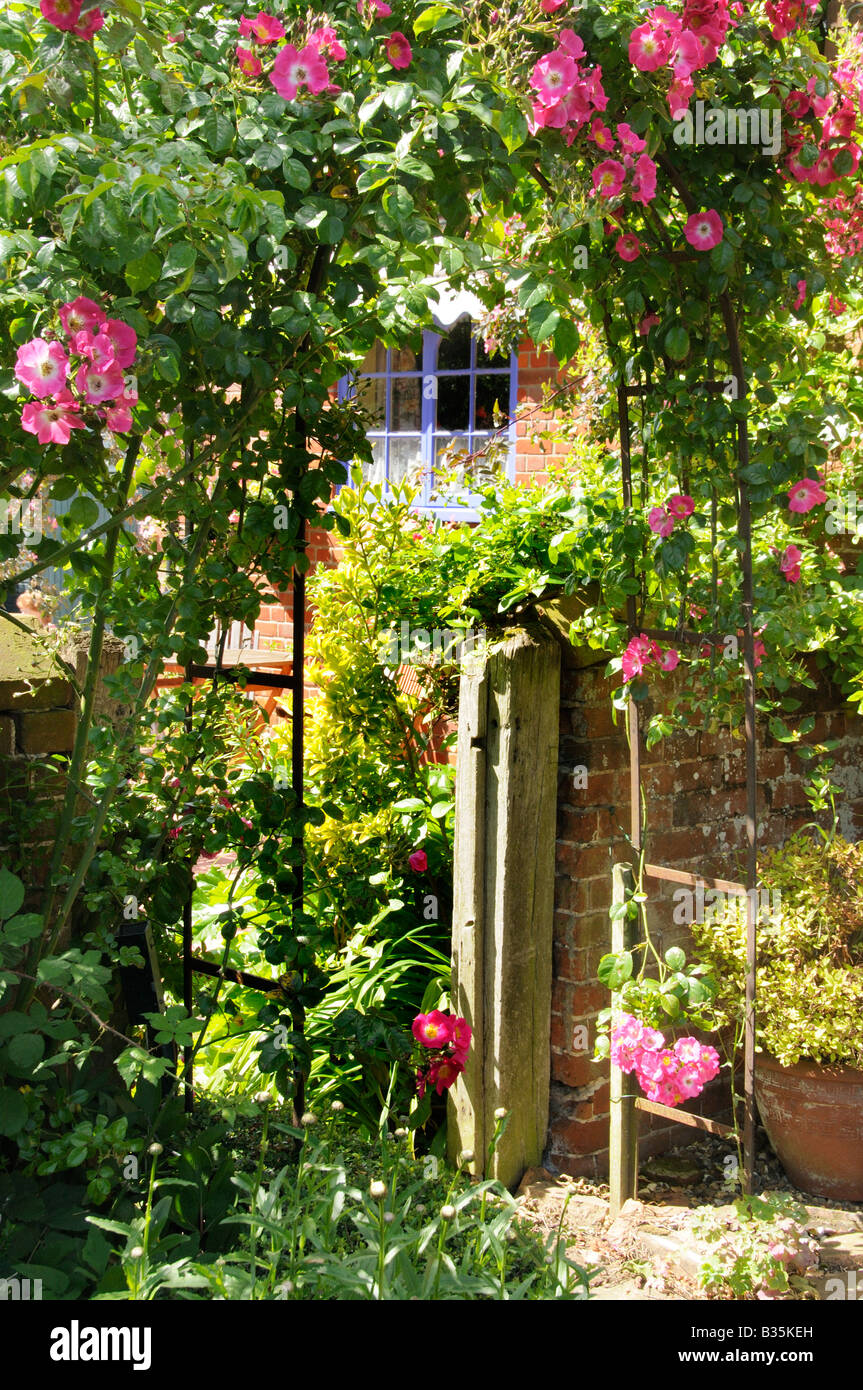 Traditional Rose Arch in a country garden England July Stock Photo - Alamy