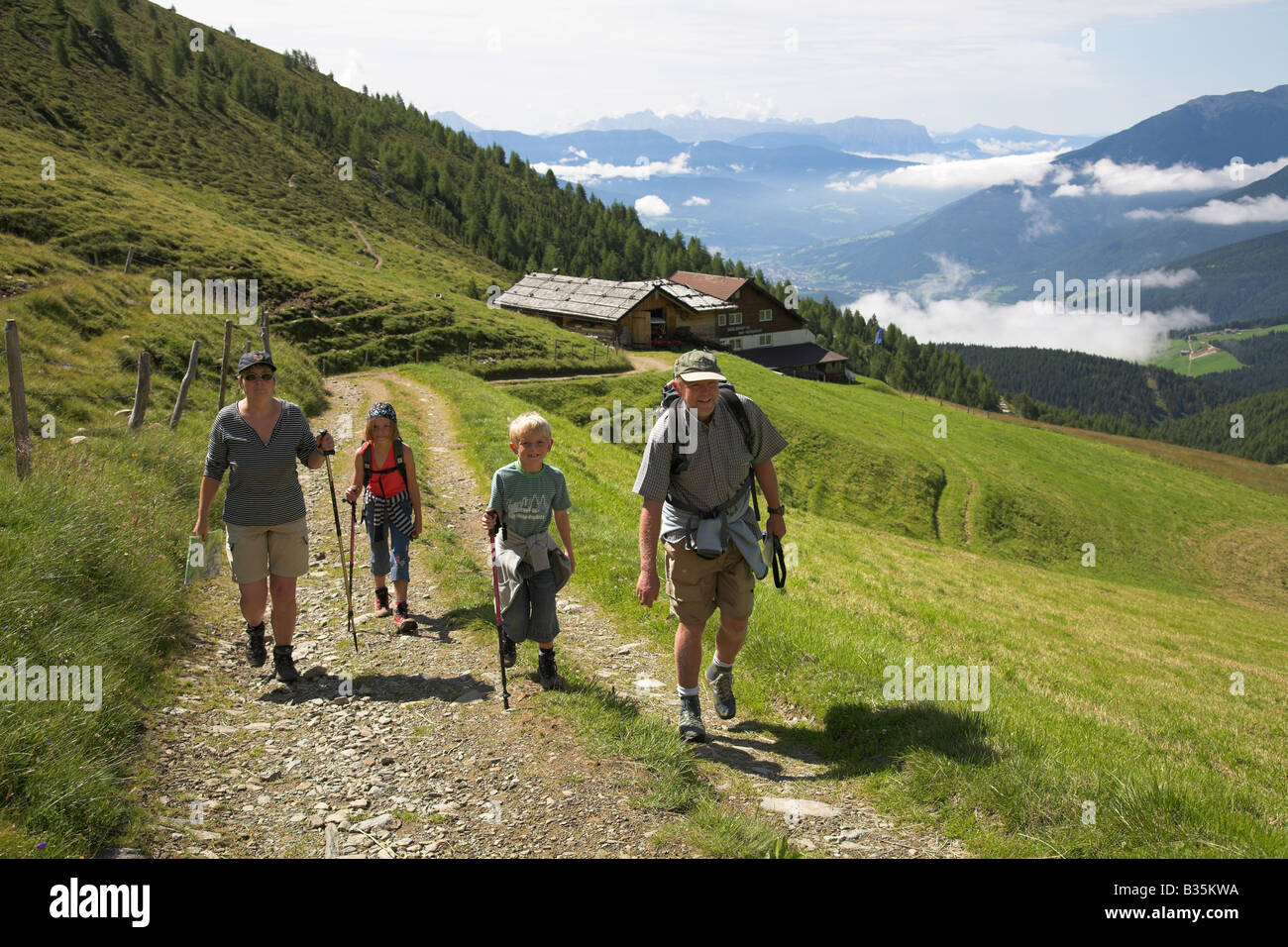 Family hiking in the mountains Stock Photo - Alamy