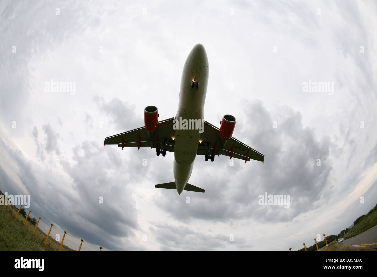 Overhead fish eye view of an Airbus twin engine jet aircraft landing ...
