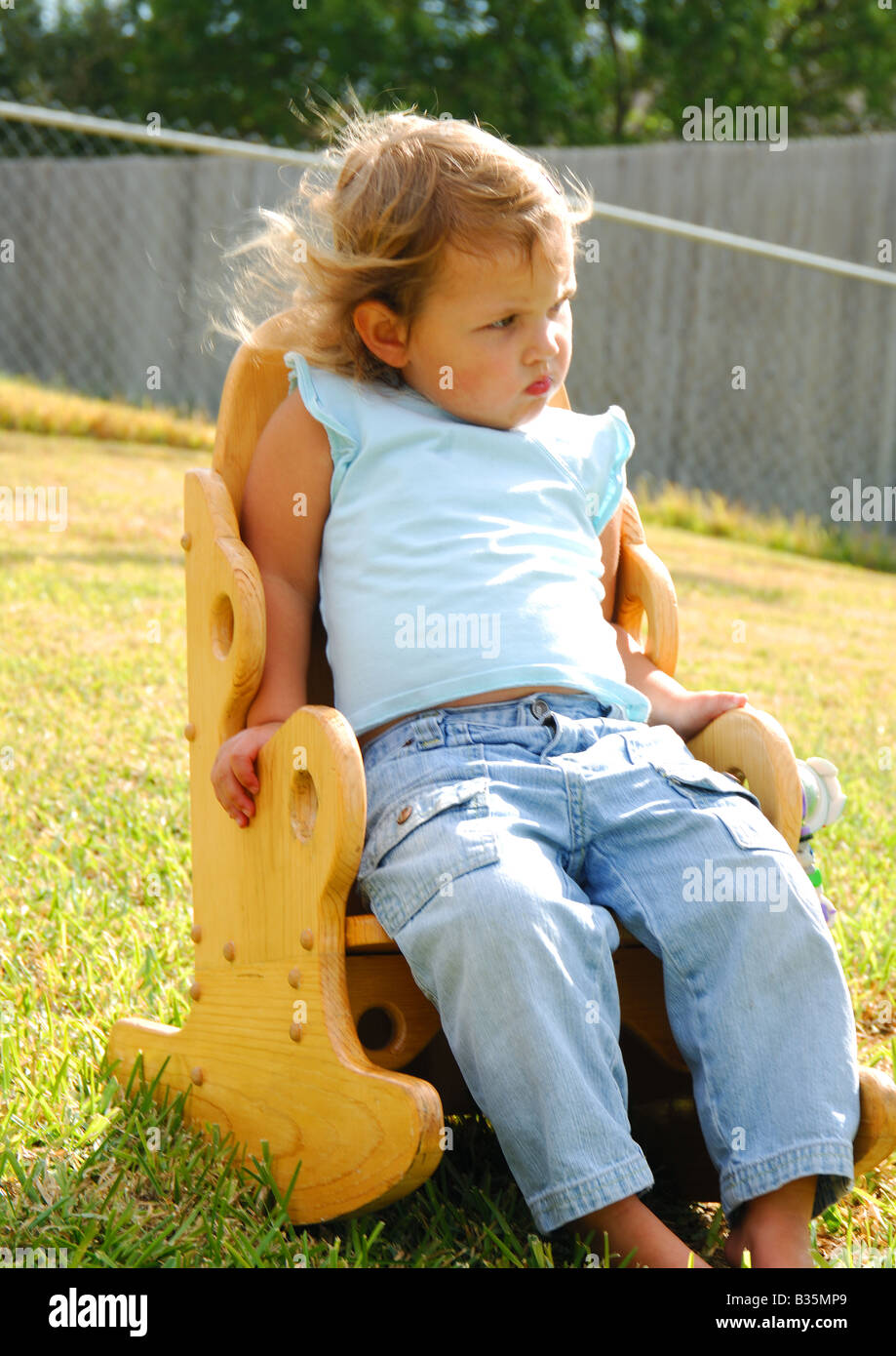 Girl barefoot grass sitting chair hi-res stock photography and images ...