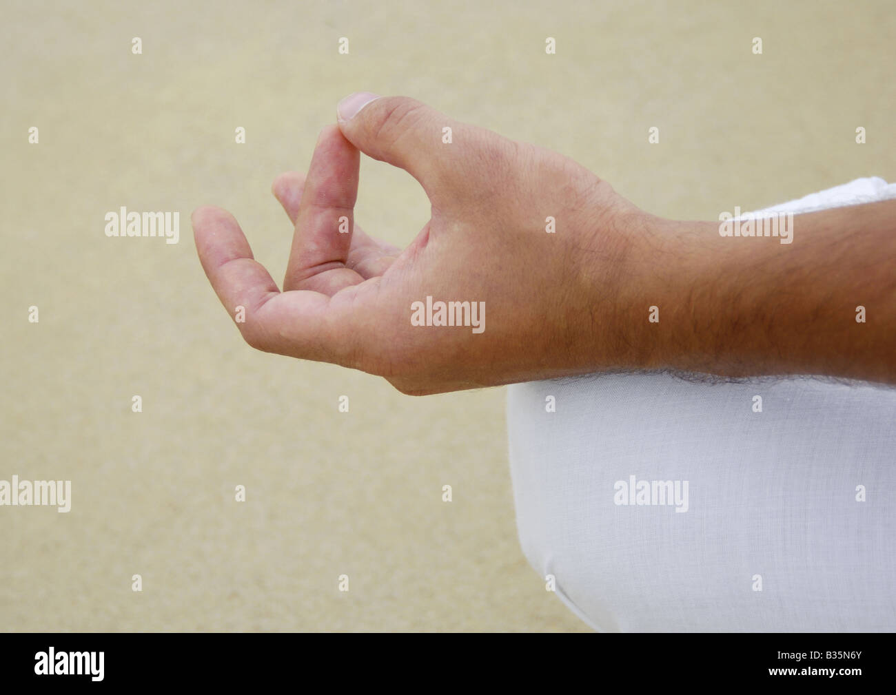 Close-up of a person's hand in the lotus position Stock Photo