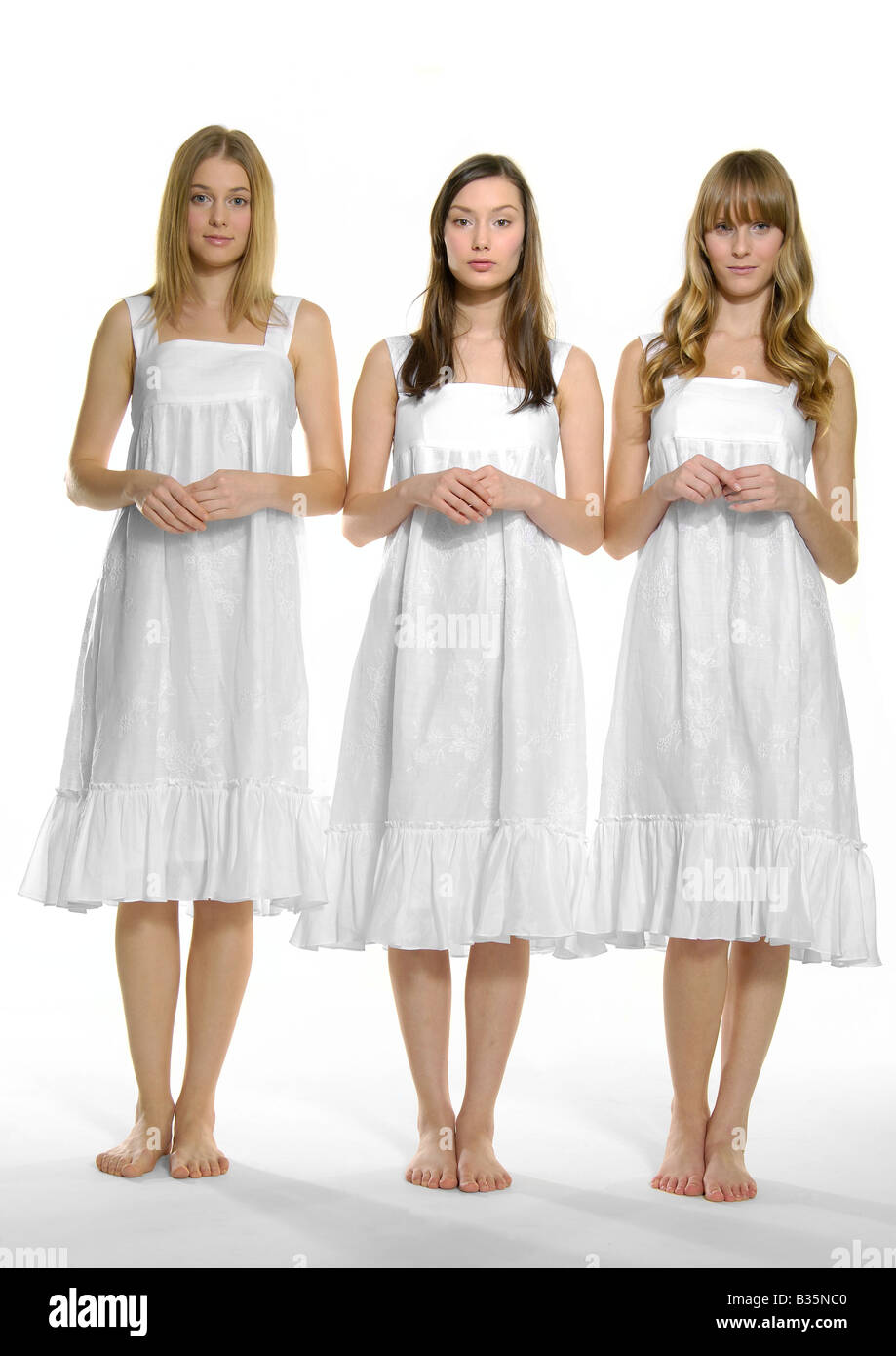 Three adults standing together hi-res stock photography and images - Alamy