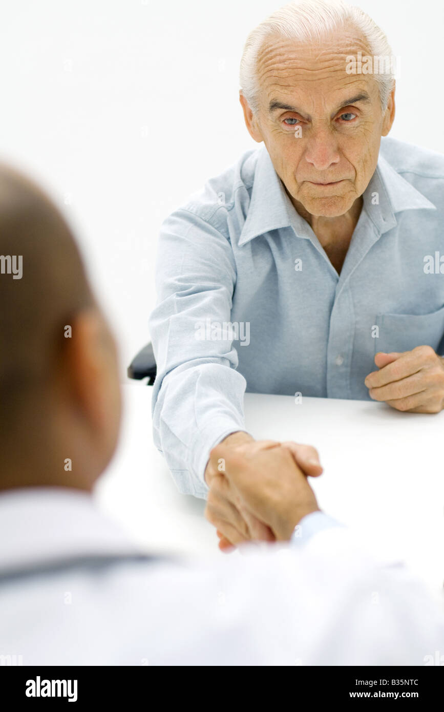 Shake hand hand on shoulder hires stock photography and images Alamy