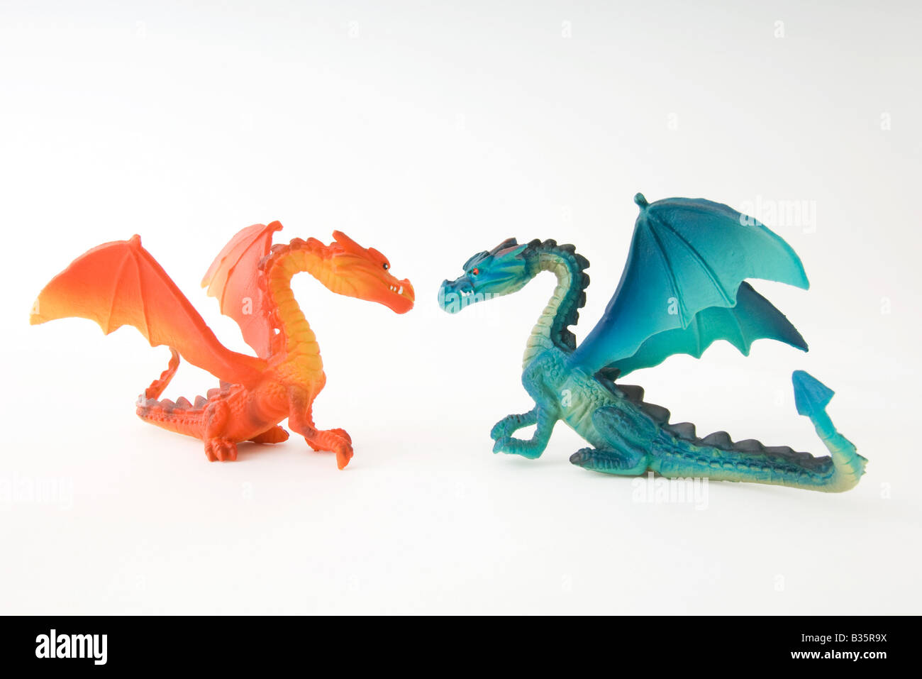 Toy dragons face to face, side view Stock Photo
