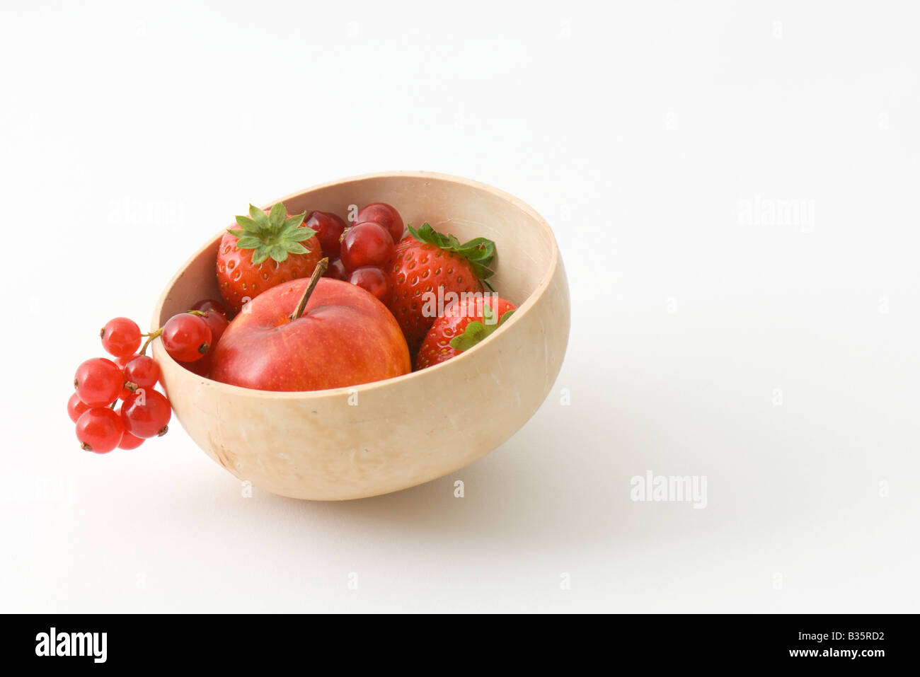 Variety of fruit in a wooden bowl Stock Photo