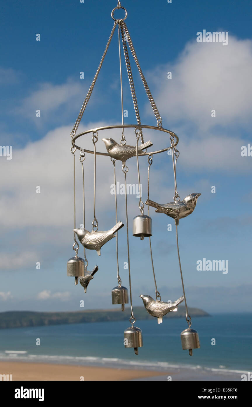 Wind-chimes wafting in a summer breeze Stock Photo