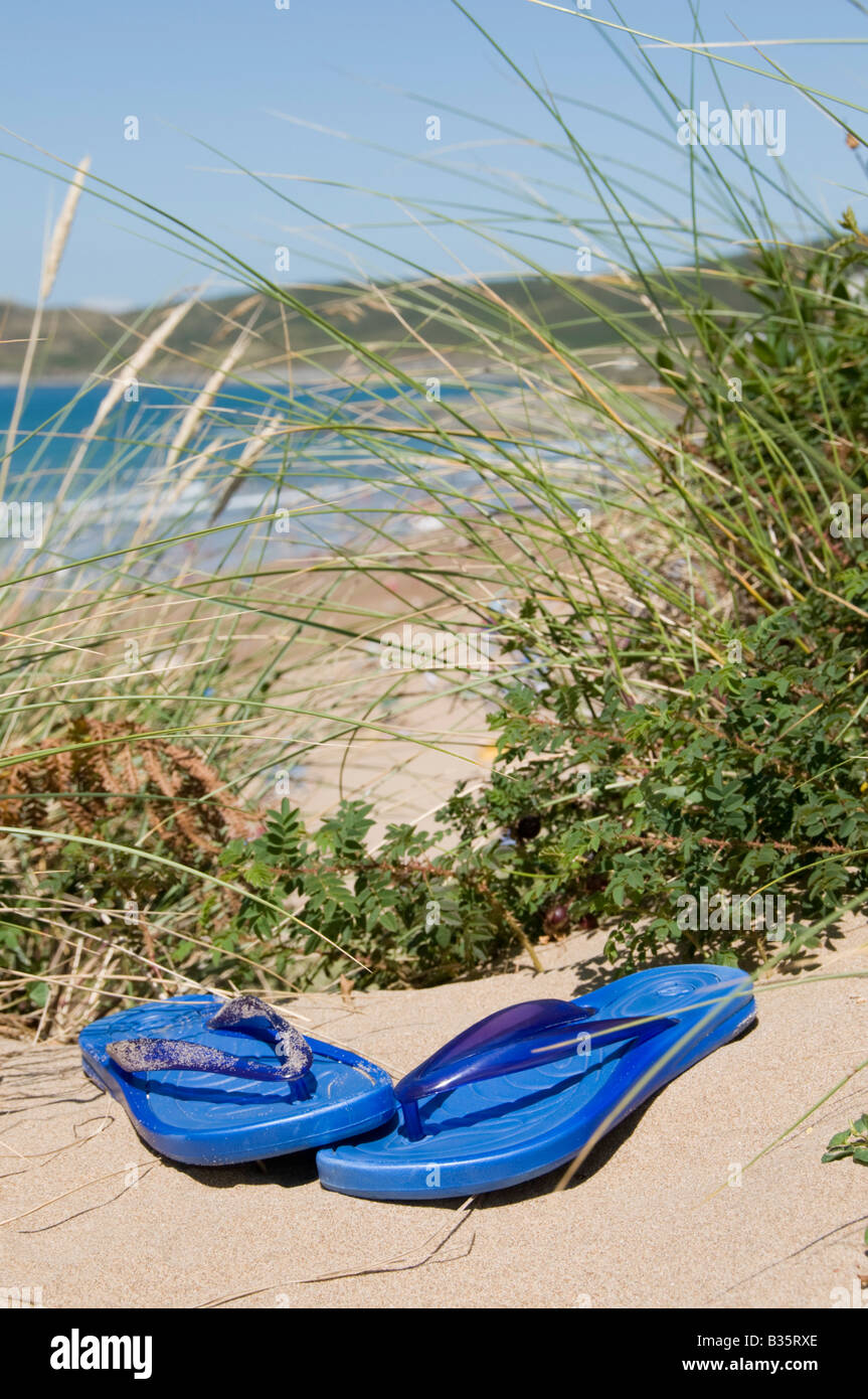 Flip flops on a sandy beach Stock Photo - Alamy