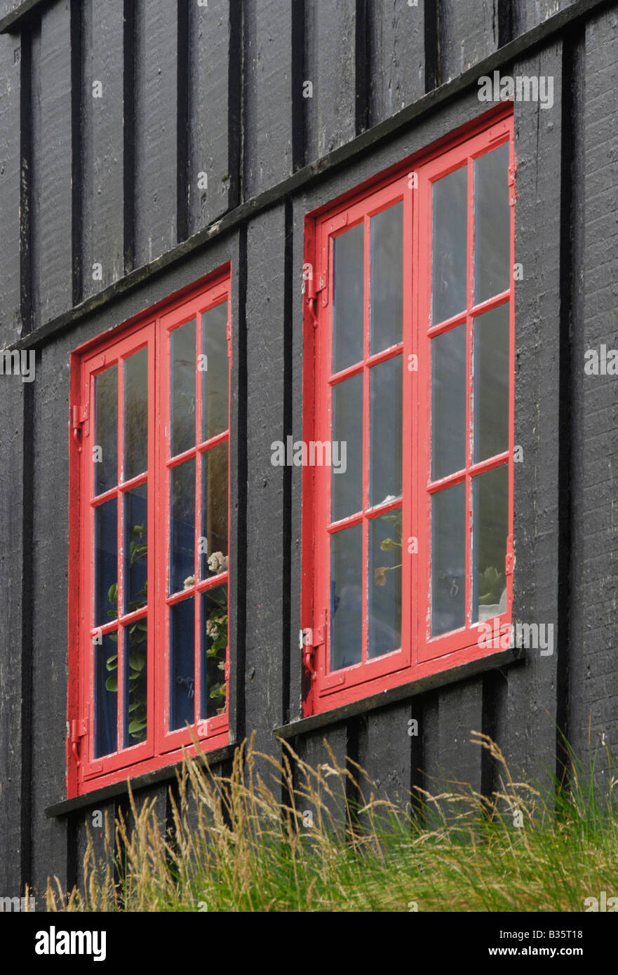 Red framed windows Kirkjuböur Faroe Islands Stock Photo
