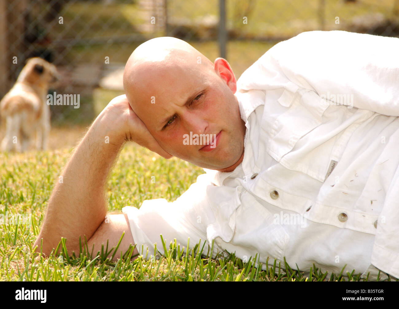 Mid adult man lying in hi-res stock photography and images - Alamy