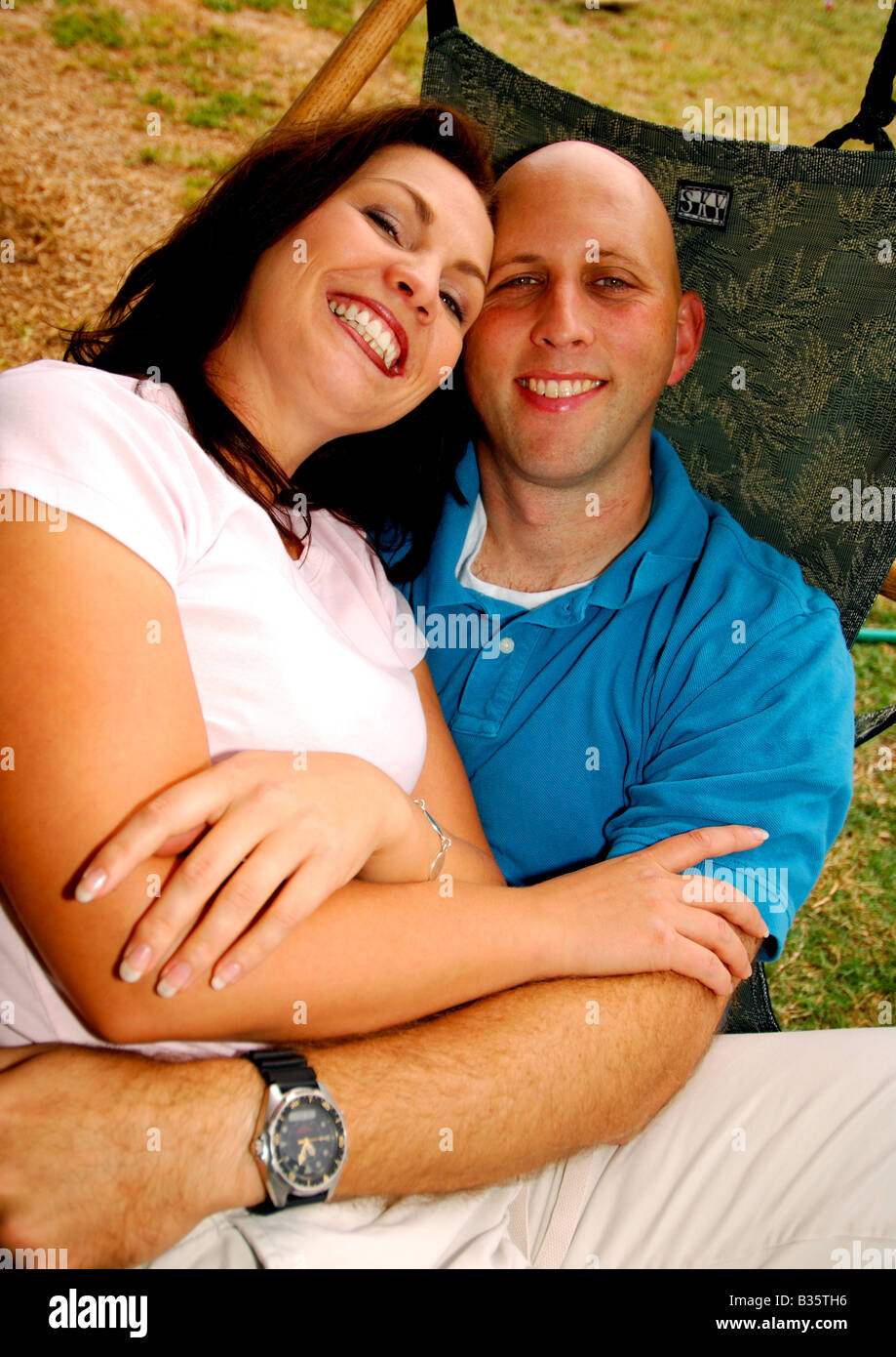 High angle view of a mid adult couple lying in a hammock Stock Photo ...
