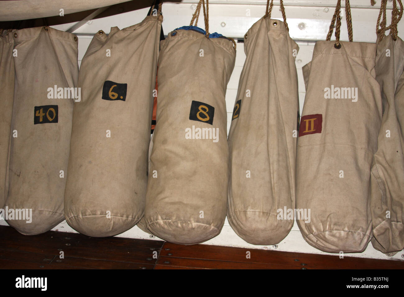 Ship duffel bags hanging on the US Brig Niagara Ship Stock Photo