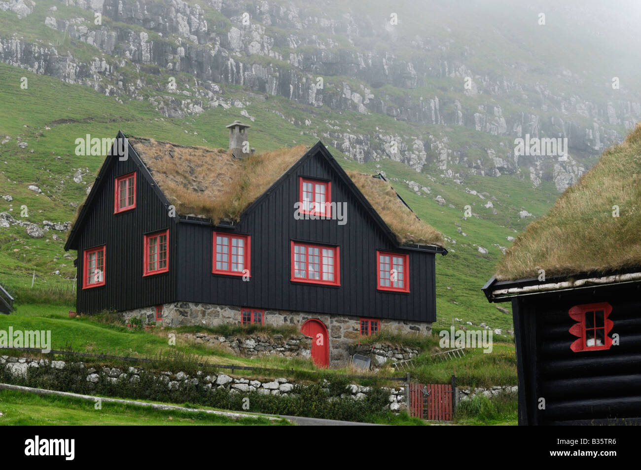 Turf roofed house Kirkjuböur Faroe Islands Stock Photo